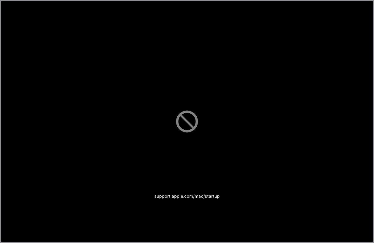 Biểu tượng cấm trên màn hình Macbook khi khởi động, cho thấy lỗi nghiêm trọng về hệ thống.