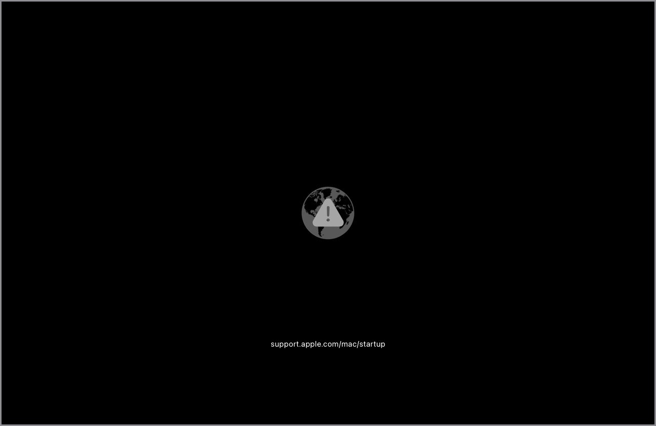 Macbook gặp lỗi khởi động Recovery với quả cầu và biểu tượng cảnh báo.