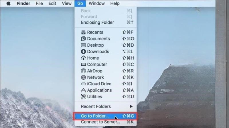 Mở cửa sổ "Go to Folder" trong Finder để truy cập các thư mục hệ thống khi khắc phục lỗi kết nối chuột Bluetooth với MacBook