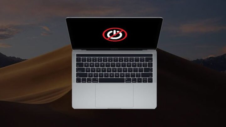 Một MacBook đang được cắm sạc nhưng không lên nguồn, minh họa vấn đề về pin hoặc bộ sạc