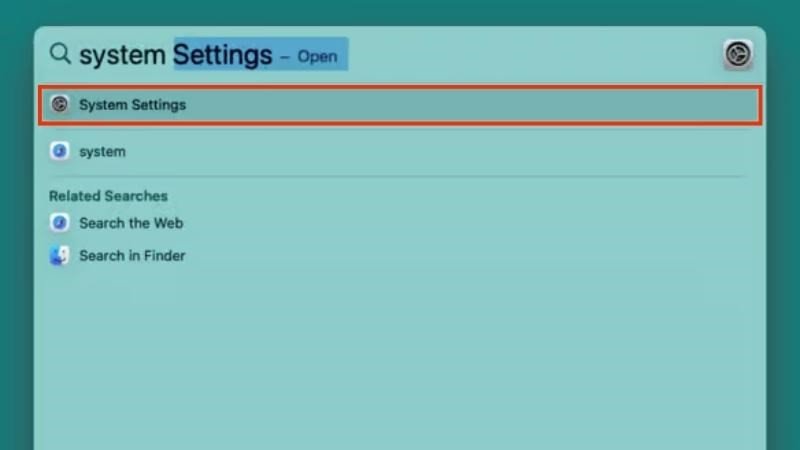 Sử dụng Spotlight để tìm và mở lại "System Settings" trên MacBook khi chuẩn bị kết nối chuột Bluetooth